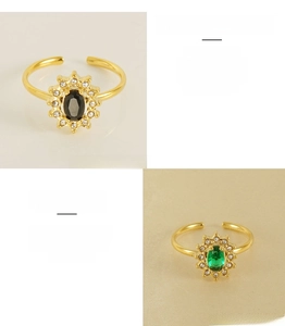 Detail of adjustable stainless steel rings with sunflower zircon and colorful gems