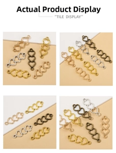 Detailed view of hollow heart connectors in gold, silver and bronze for DIY jewelry