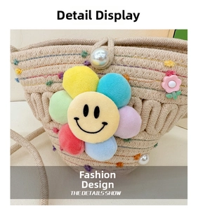 Close-up of woven straw bag featuring colorful plush flower and pearl floral accents