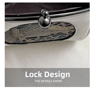Detailed macro view of vintage clasp with intricate fish pattern engraving on the shell bag