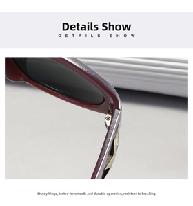 Macro detail of high-quality metal hinge and dark red frame on trendy sunglasses