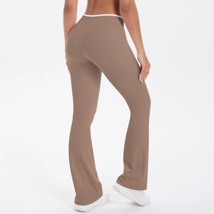 Rear view of high-waisted flare yoga pants in brown with white contrast waistband trim