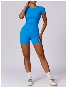 Detail of blue tight-fit yoga set showing breathable fabric and slimming athletic design