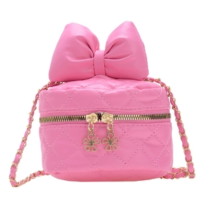 Pink quilted bow crossbody box bag with floral zipper charms and golden chain strap