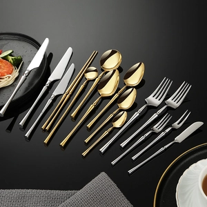 Mirror polished 304 stainless steel cutlery set with knives forks and spoons on black background