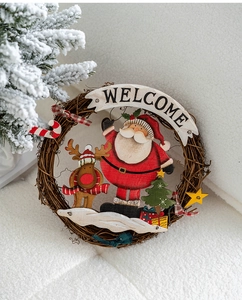 Detail of Christmas welcome sign with Santa, reindeer, and rustic vine wreath decorations