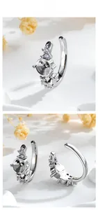 Macro detail of silver polished earring base with sparkling zircon settings for DIY jewelry