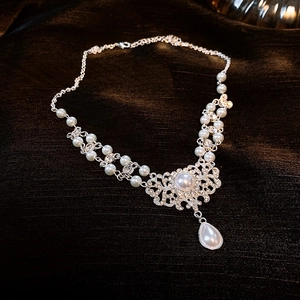 Silver bead necklace featuring white freshwater pearls and crystal drop pendant