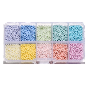 Detailed top view of 10-compartment storage box with colorful glass seed beads for DIY