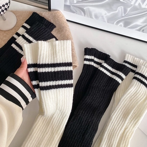 Knit Y2K leg warmers with sporty stripes in black and white ribbed fabric for women