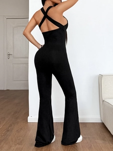 Sexy black halter neck jumpsuit with backless cross straps and flared leg design