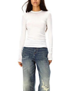 Detail of slim fit white wool t-shirt paired with distressed blue denim jeans