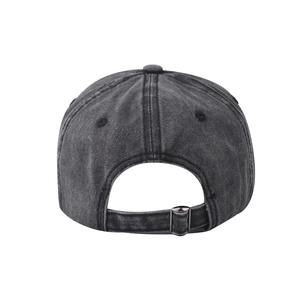Detail view of washed denim baseball cap back with adjustable silver metal buckle strap