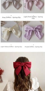 Detail of oversized chiffon JK bow hair clips in grey, pink, yellow, purple and red colors