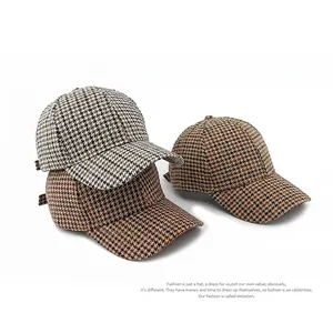 Classic houndstooth baseball cap set in premium tweed fabric for autumn sun protection