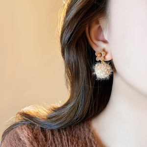 Brown flocked flower earrings with beige plush balls for a vintage autumn winter look