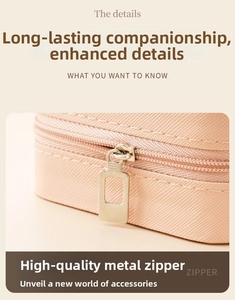 Detail of high-quality golden metal zipper on a textured pink PU leather jewelry box