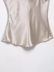 Close-up of the satin camisole featuring high-quality silk-like fabric and curved hem