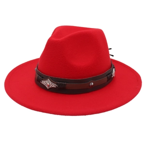 Detail of red wool fedora featuring leather band and vintage silver metal ornaments