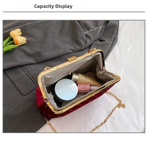 Interior view showing the capacity of this red velvet quilted chain shell bag