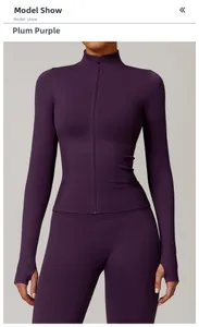 Detail of plum purple yoga jacket with stand collar, zipper, and thumbhole cuffs