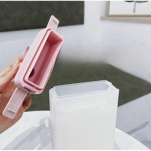 Detail of square water bottle with detachable pink lid for easy filling and cleaning