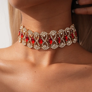 Close-up of a vintage choker with red marquise stones and white rhinestones on model