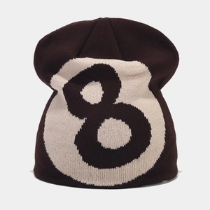 Detailed knit texture of a black 8-ball beanie with white embroidered number eight