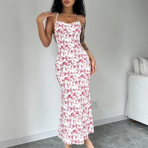 Detail view of a sexy floral backless maxi dress with side slit and slim fit silhouette