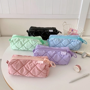 Quilted nylon stationery bags in five pastel colors with large zipper and woven label