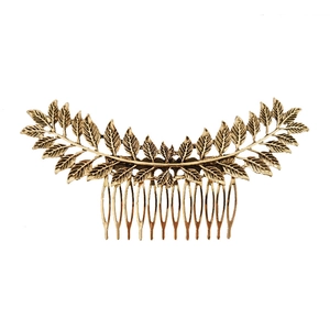 Vintage bronze alloy hair comb with laurel leaf branch design on white background