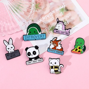 Detailed view of 7 cute metal enamel animal pins on pink background with witty quotes