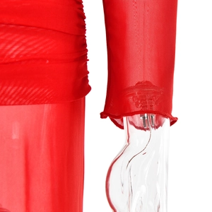 Detail shot of red sheer mesh fabric with elegant pleated texture and long sleeve cuff