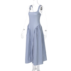 Detailed view of A-line plaid dress featuring square neck and backless straps