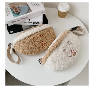 Close-up of brown and white plush lamb wool waist bags with cute bear embroidery detail