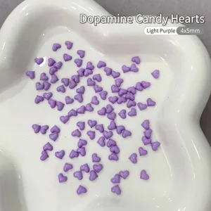 Macro detail of 4x5mm light purple resin candy heart charms for nail art decoration