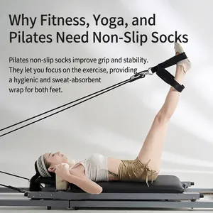 Cotton non-slip yoga socks for pilates shown on a reformer machine with grip dots