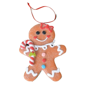 Gingerbread man Christmas ornament with candy cane and red bow for holiday tree decoration