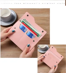 Pink lychee grain leather wallet organizer with card slots and metal snap closure