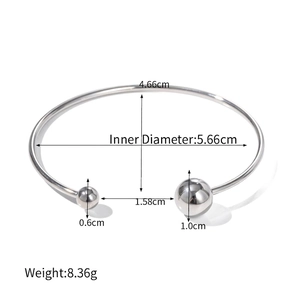 Polished stainless steel open cuff bangle featuring asymmetric beads measuring 10mm and 6mm