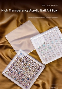 Close-up of clear acrylic nail art organizers with heart and bow charms on silk fabric