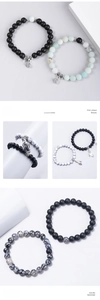 Detailed close-up of beaded couple bracelets with magnetic clasps and palm charms