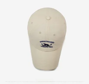 Top view of cream white quick-dry baseball cap with navy blue polar bear embroidery