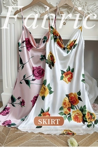 Close-up of floral satin slip dress fabric texture with rose patterns and silky shine