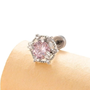 Pink heart-cut zircon stud earring in silver steel with bow details on display stand