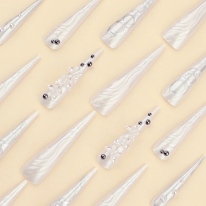 Extra long stiletto fake nails with 3D aurora butterflies, black studs and pearl accents