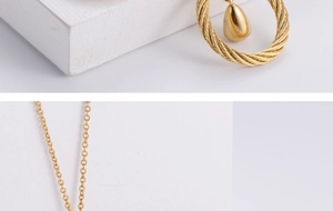 Macro detail of golden twisted rope ring with a teardrop pendant in minimalist style