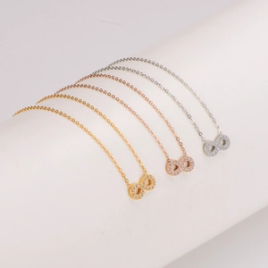 Three-color infinity pendant necklaces with zircons in gold, silver, and rose gold finish