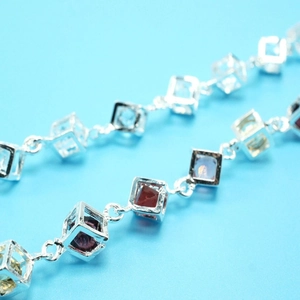 Silver geometric square link bracelet with multi-colored gemstones in minimalist style