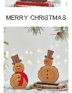 Detail of wooden snowman ornaments with natural wood grain and merry christmas print